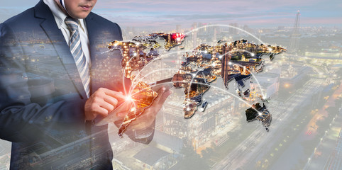 energy power concept : double exposure of businessmen using smart phone with Oil and gas industry -...