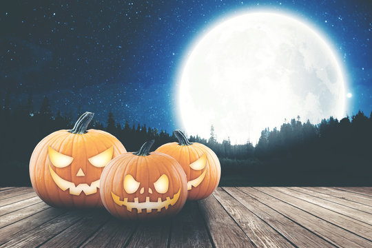 pumpkin's on the wood with night meadow and moon