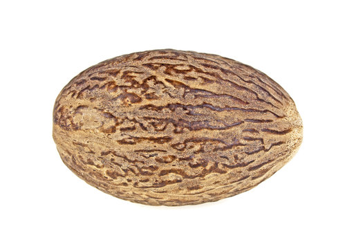 Single nutmeg isolated on a white background