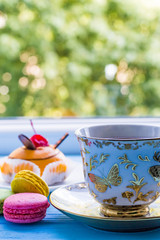 Still life with cup of tea on the wooden background