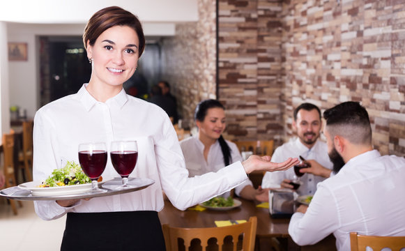 Portrait of waitress working in ordinary restaurant