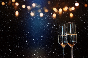 Champagne with blue spotlight and golden bokeh