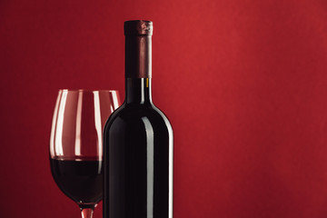 red wine in glass and bottle