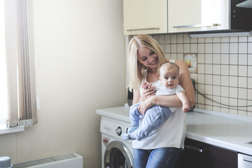 blonde mom with baby in her arms,  real interior