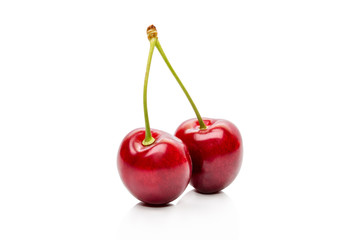 Two Cherry on a peduncle isolated on a white background