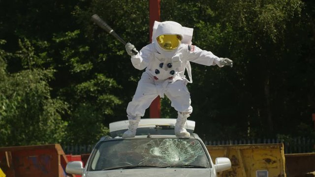  Hooligan Astronaut Smashing Car Windshield With A Baseball Bat.