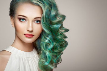 Beauty fashion model girl with colorful dyed hair. Girl with perfect makeup and hairstyle. Model...