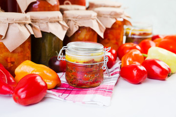Preserved on home table. Various homemade conserves in glass jars