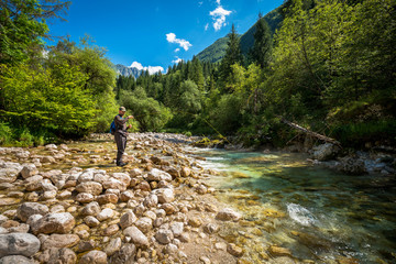 Fly fisherman fishing trouts in river
