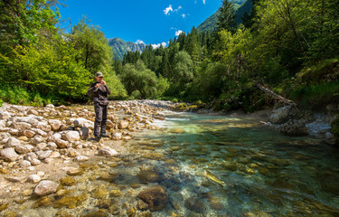 Fly fisherman fishing trouts in river - 172813503