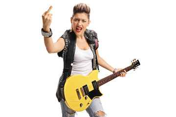 Angry punk girl with electric guitar showing her middle finger