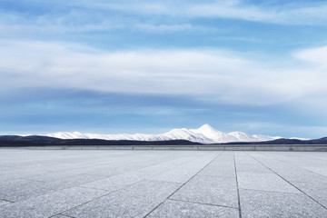 empty marble floor with snow mountains