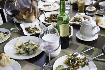 A variety of salads and a glass of dry wine - an integral part of a good dinner