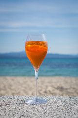 aperol spritz in the sun on a seaside terrace