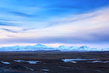 snow mountains against beautiful blue cloud sky
