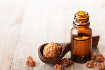 myrrh essential oil on the wooden board
