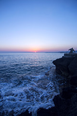  Landscape of Sunset fishing silhouettes of fishermen near the sea coast 