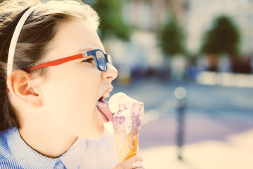 young hipster girl eating a delicious ice cream in summer - vintage filter