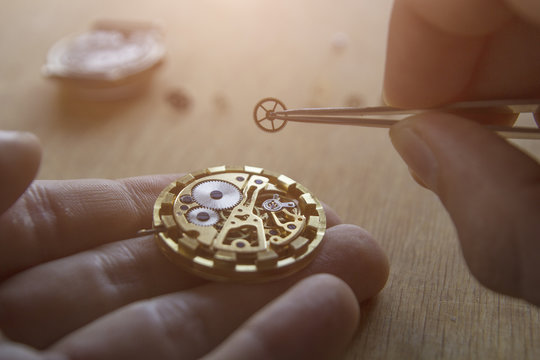 Watchmaker is repairing the mechanical watches in his workshop