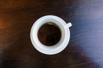 wonderful white cup of hot coffee on table