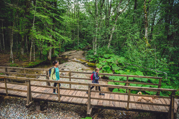 Mother and daughter hiking in forest