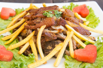 Pork leg fried with French fries