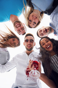 Summer Vacation, Happy People - A Group Of Teenagers Looking Down With A Happy Smile On His Face.