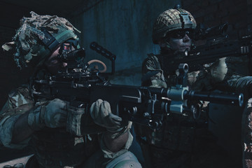 Special Forces soldiers in action. A soldier is preparing to make a shot