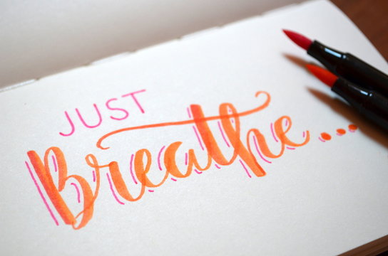 JUST BREATHE hand-lettered on in notebook