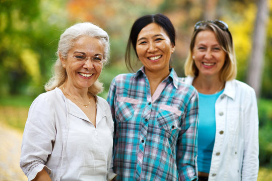Three mature ladies smiling