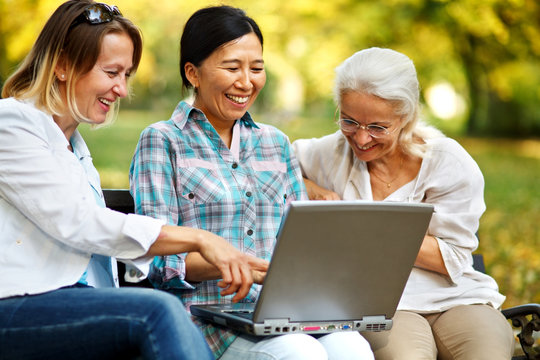 Mature women reading on a laptop