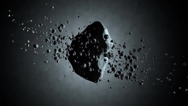 3D rendered Animation of Asteroid floating in space	with orbiting rocks.
