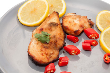 Roast chicken with chilli, lemon on plate