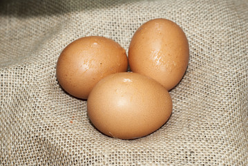 Three eggs on sackcloth