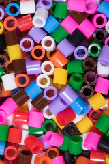 
colored plastic pipe pieces