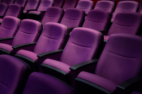 Purple comfort seat in theater.