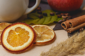 Cocoa or latte or hot chocolate with cinnamon. On a bright wooden background.