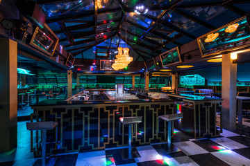 Caffe bar interior with skylight by night - obrazy, fototapety, plakaty