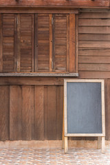 blank menu board on wood wall