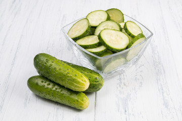 cucumbers on a white wooden background