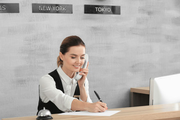 Female receptionist working in hotel