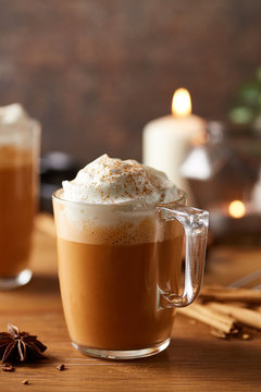 Tasty pumpkin spice latte with cream.