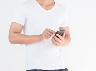 Young man using mobile smart phone on white background.