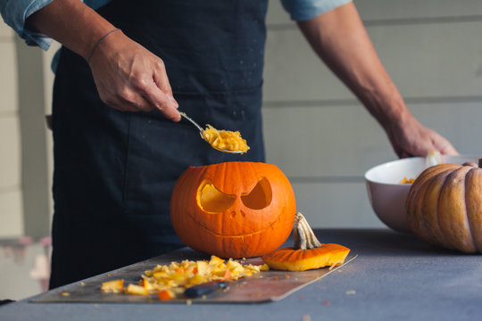 A pumpkin in the process of being carved for halloween