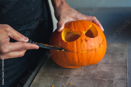Carving a pumpkin for halloween