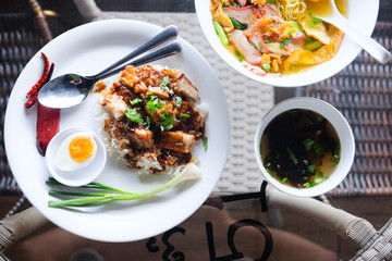 Crispy pork and rice in white dish