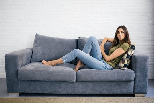 Woman Relaxing On The Sofa At Home