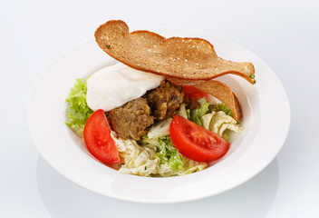 Restaurant food. Salad with bread in a plate. Delicious food.