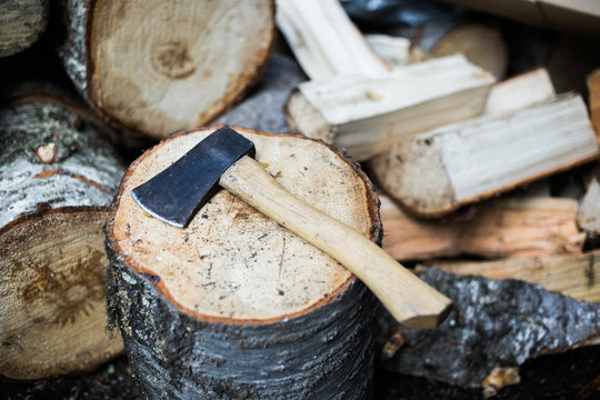 Hatchet on a woodpile