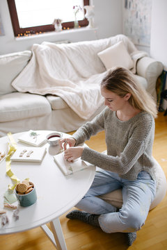 Woman Wrapping Christmas Gifts